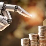 A robotic hand pointing towards stacks of coins, symbolizing artificial intelligence driving growth and transformation in the banking and finance industry.